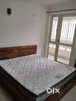 Solid wood bed and 8 inch spring mattress.