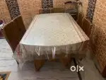Dinning table  wooden with glass  and six  chairs