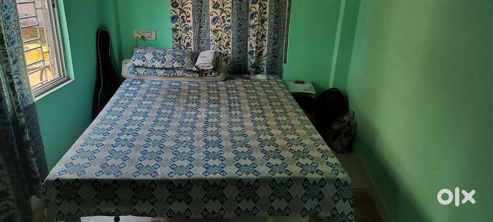 Wooden bed and mattress