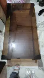 Black glass centre table with steel stand