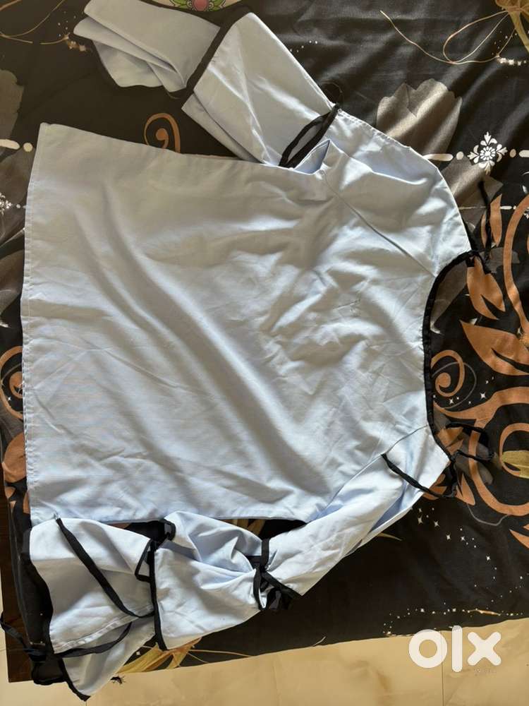 The top is in blue colour it has bow detailing in it