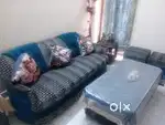 Five seater sofa with two puffy with centre table with two side table
