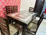 6 seater dining table in brown colour