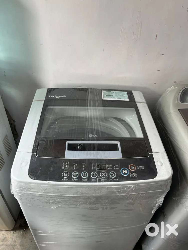 L. G washing machine automatic top load with warranty good condition