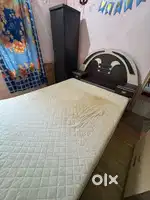 Double bed with mattress side storage drawers and single door wardrobe