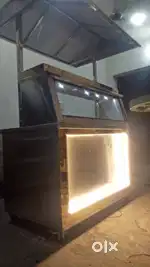Food cart with refrigerator installed and griller with its table.
