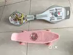 Pink Skateboard and Grey Waveboard