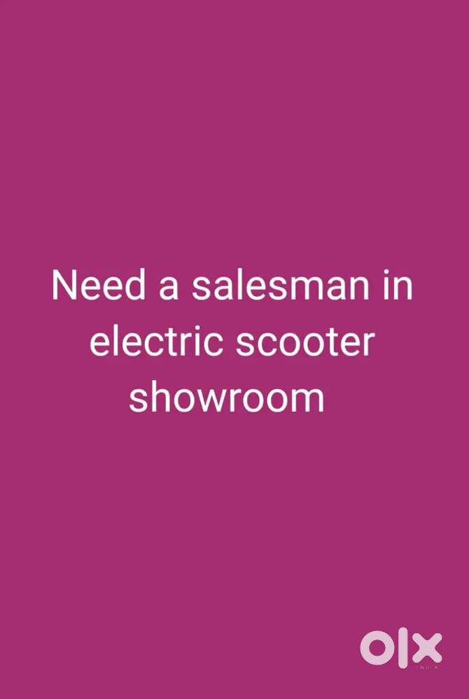 Sales man in electric scooter showroom