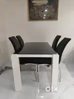 Four seater dining table wood with glass