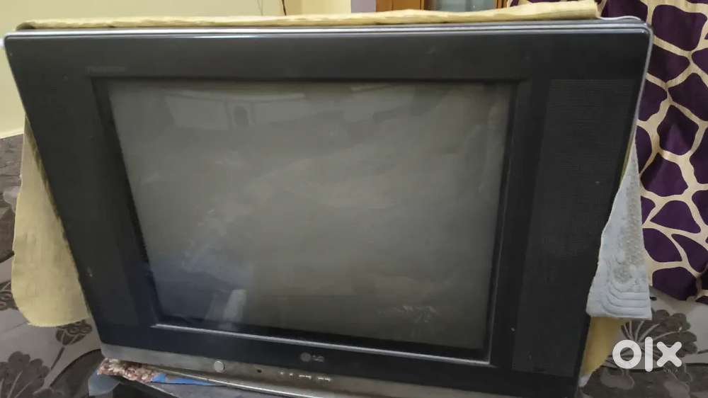 Lg Flatron TV with wooden Tv trolley