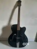 Hobner guitar with new strings and capo