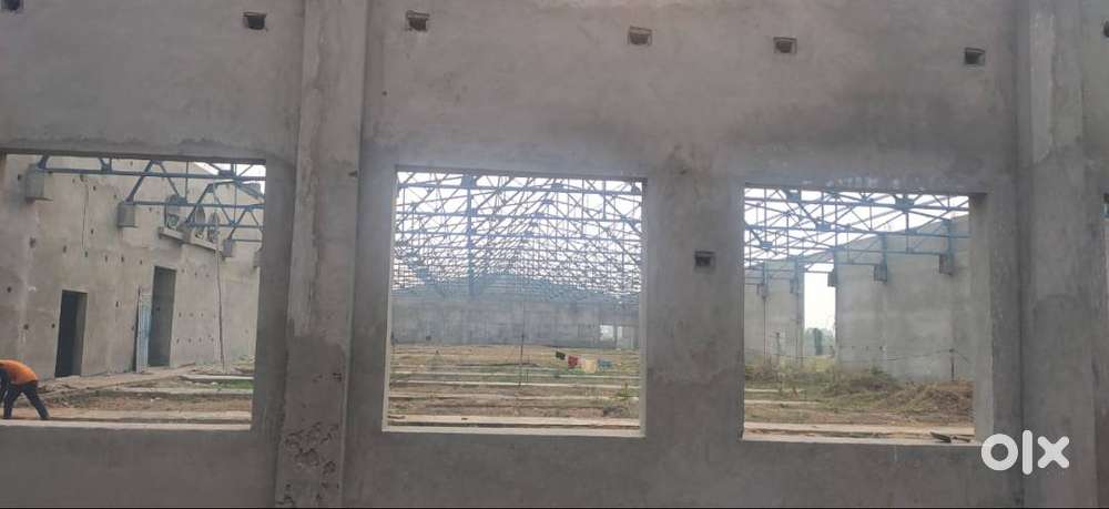 Industrial land with newly constructed shed .