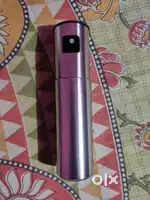 Oil despensar stainless steel metal bottle.