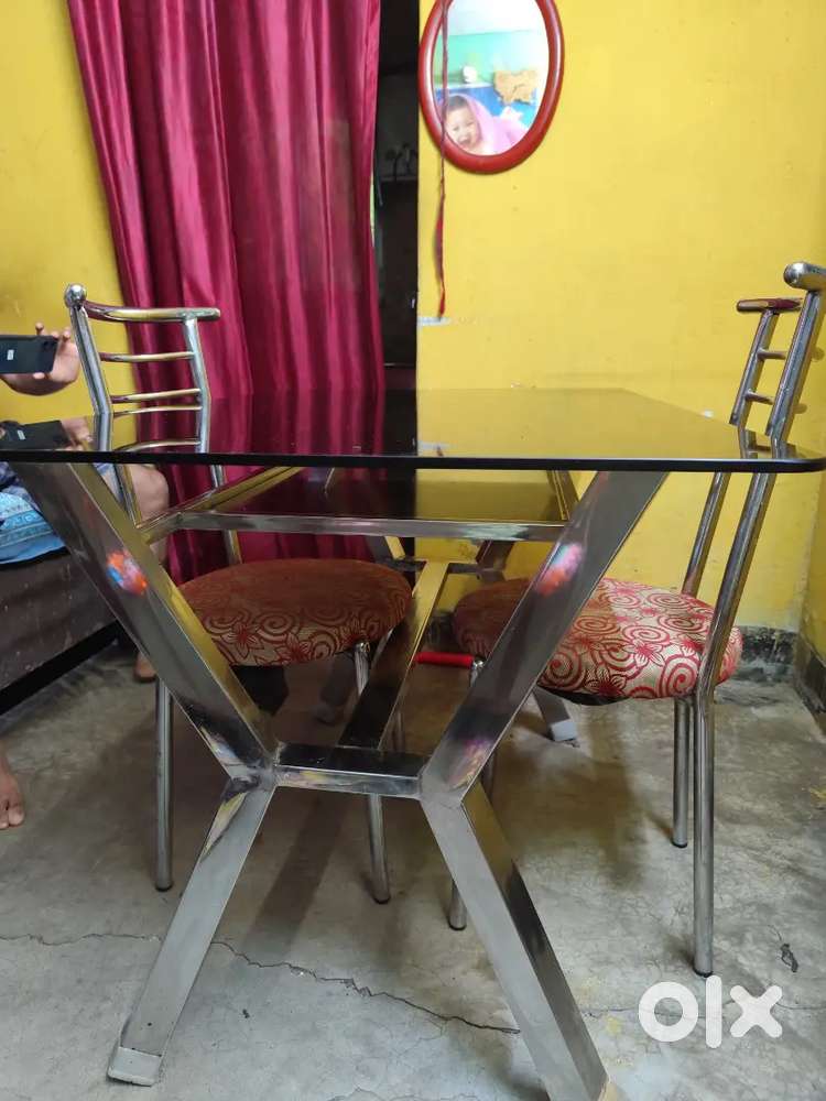 4seater dining glass table with two chairs