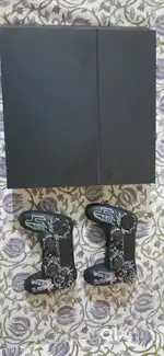 PlayStation 4 standard 1tb with 2x controller and lots of games in it