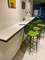 Wall mountable table and tall chairs