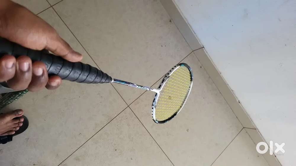 Badminton racket with grip