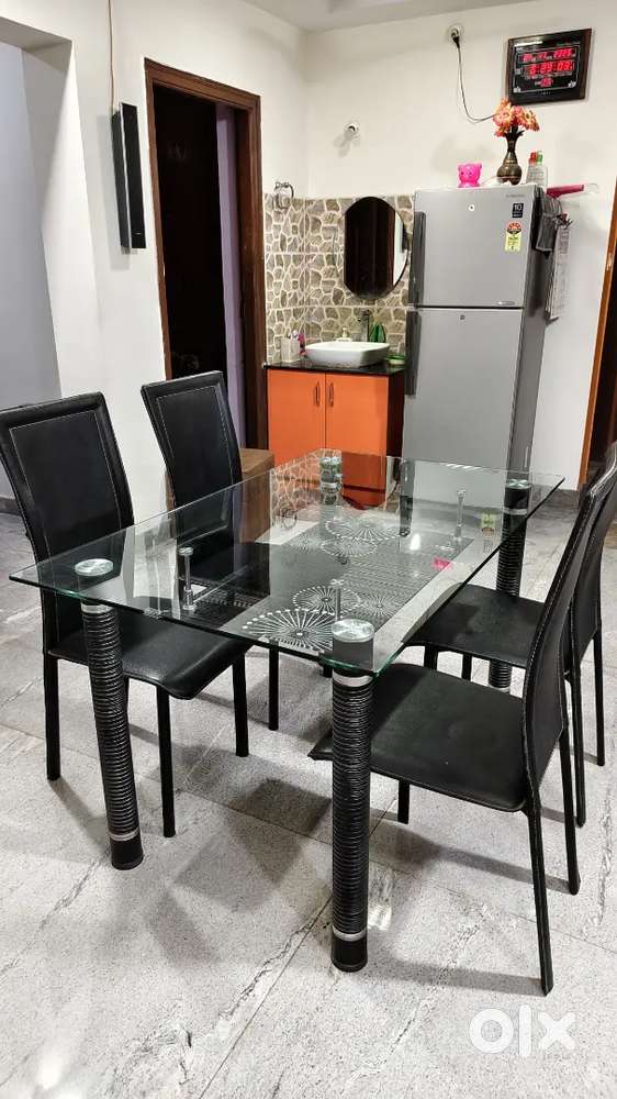 Royal Oak Glass Top Dining Table - 4 Seater with Black Chairs.