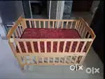 Babyhug wooden cot with mattress and mosquito net having storage space