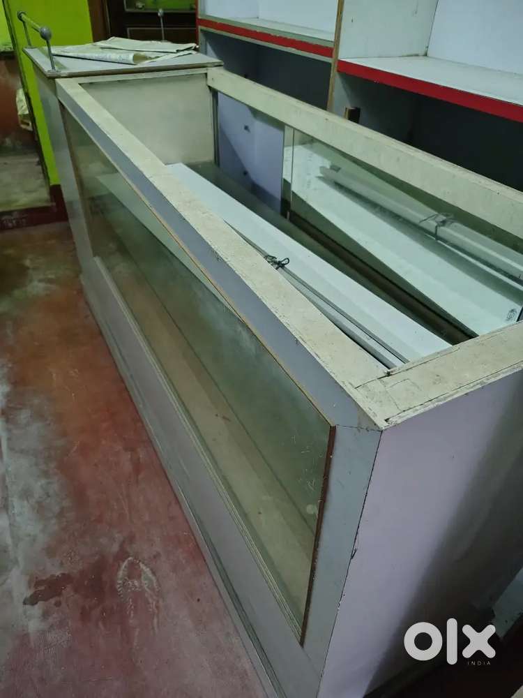 3 nos Wall show case and one no wooden counter with  glass top.