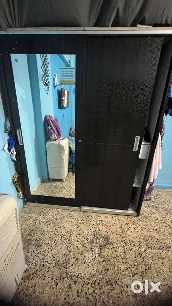 Sliding wooden cupboard in good condition hand made customised pice