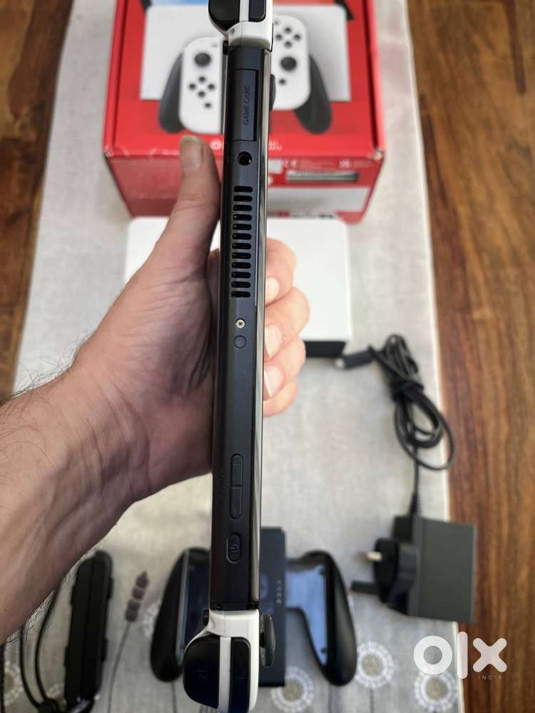 Nintendo Switch OLED Model, 2022, 64GB includes 128gb memory card.