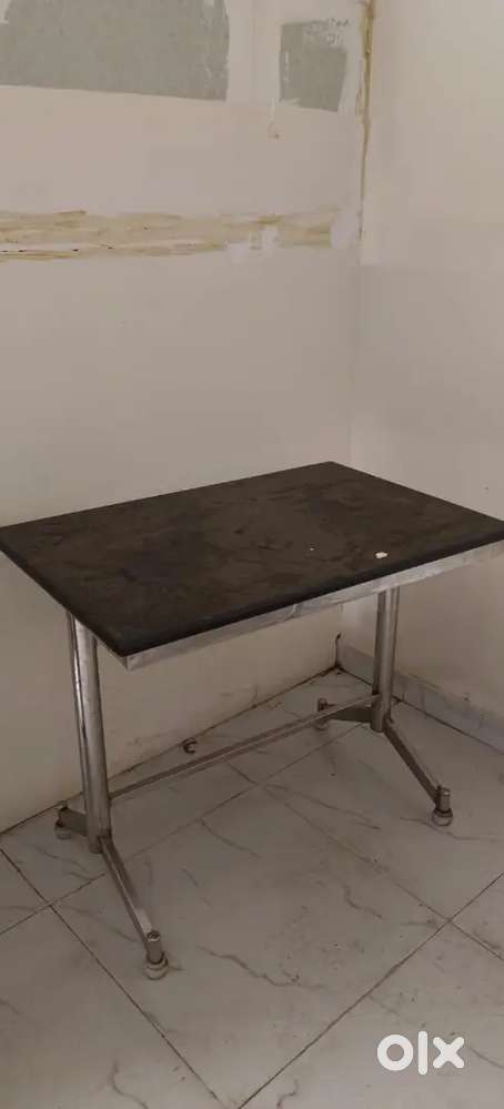 Granite table with silver beeding and chairs