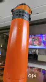 Orange colour steel milton water bottle having lock to open storage 1l