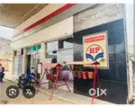 Boy for daily needs shop near petrol pump