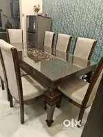 Dining Table along with 8 straight back chairs.
