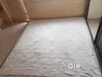 King size mattress with white protector