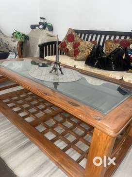Rectangular glass top wooden center table with storage