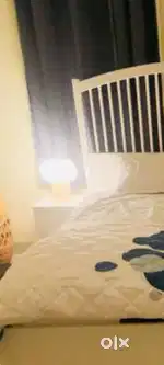 Ikea Bedside table along with lamps
