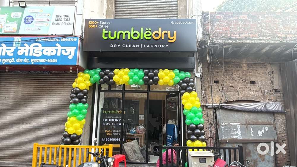 Washing man in dry cleaning store