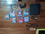 2022 Sony PS4 with 1 controller and 7 CD games