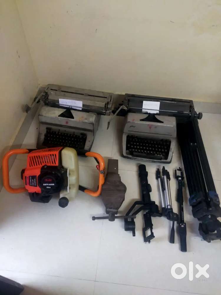 Camera stand , typewriter, earth drilling machine.