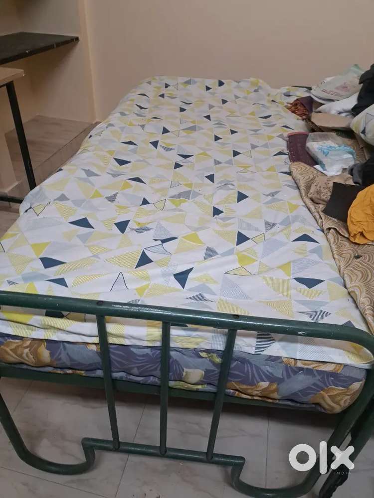 Steel cot with bed for sale