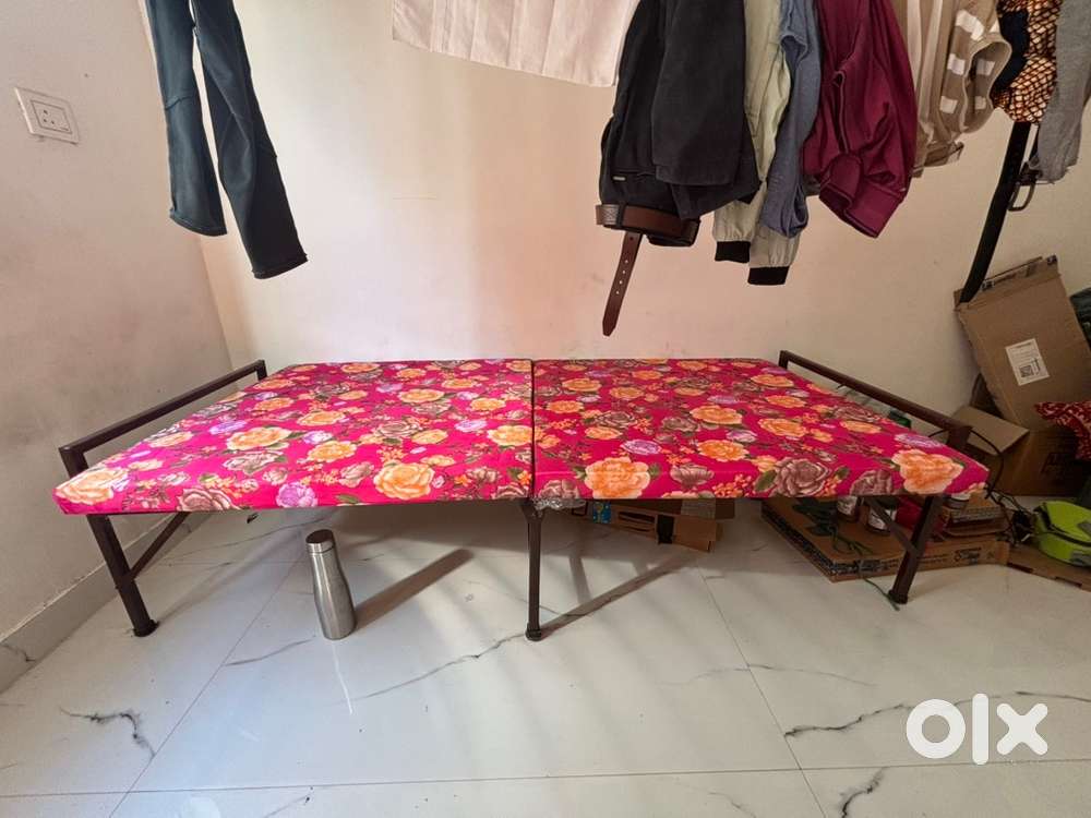 One folding bed with a dress stand