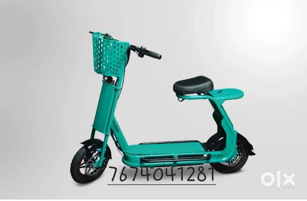 Scooty driving on ev versatile vehicle for women