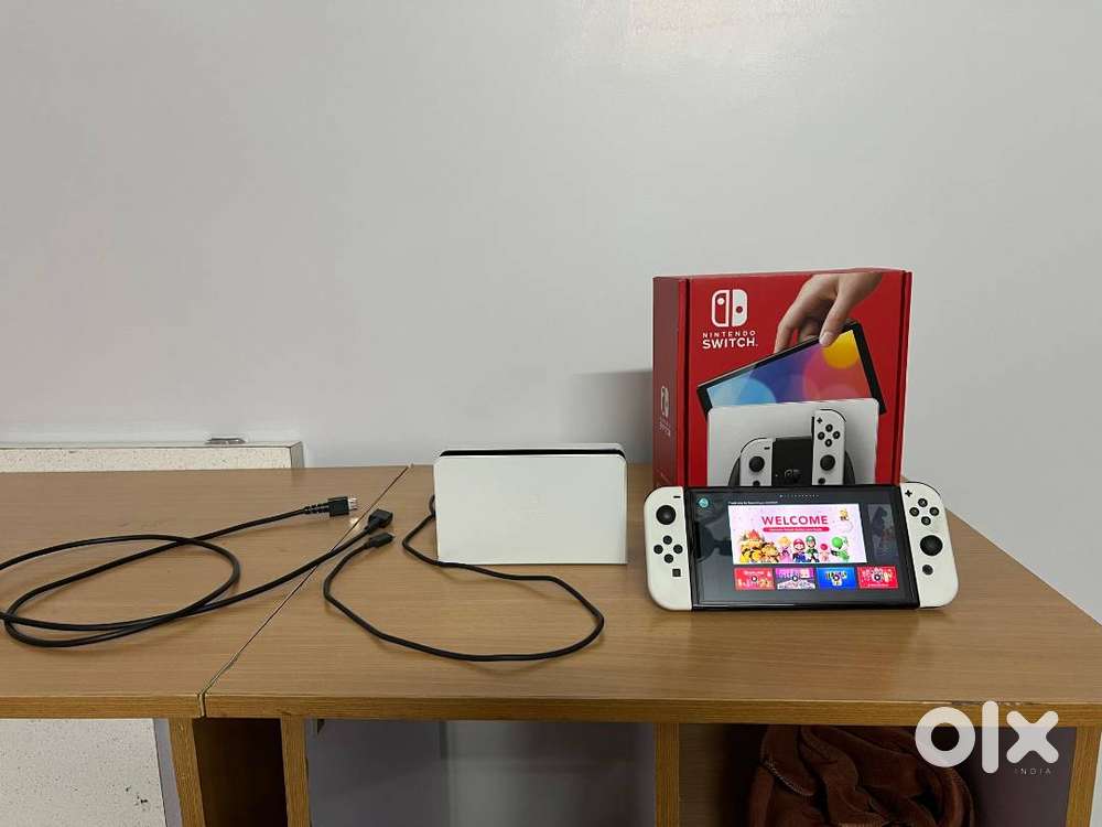 Nintendo Switch OLED (Mint condition with box and all accessories)