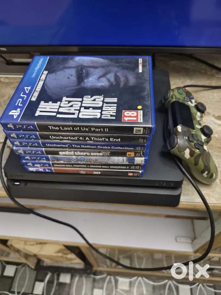 Ps4 SLIM 1TB with 20 games and controller