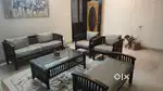 Wooden 7 seater sofa set and a center table