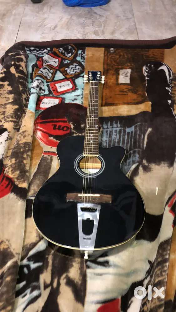 Jimm guitar with new strings bought new at 7.9k recently