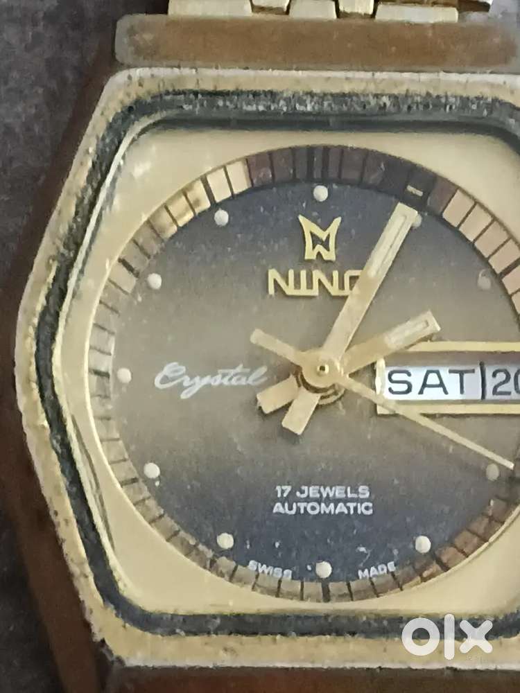 Old Antique automatics wrist watch with day date with golden chain