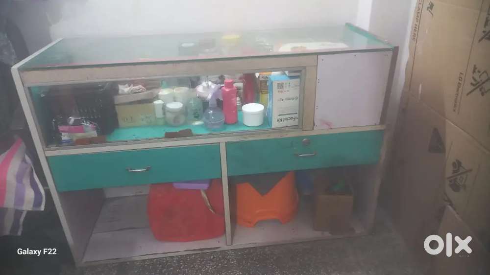 Table cum counter with front glass display rack