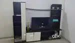 A Well Maintained TV Cabinet with Closed door Cupboards for Sale