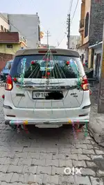 Ertiga gadi white color company CNG pass Bareilly transfer
