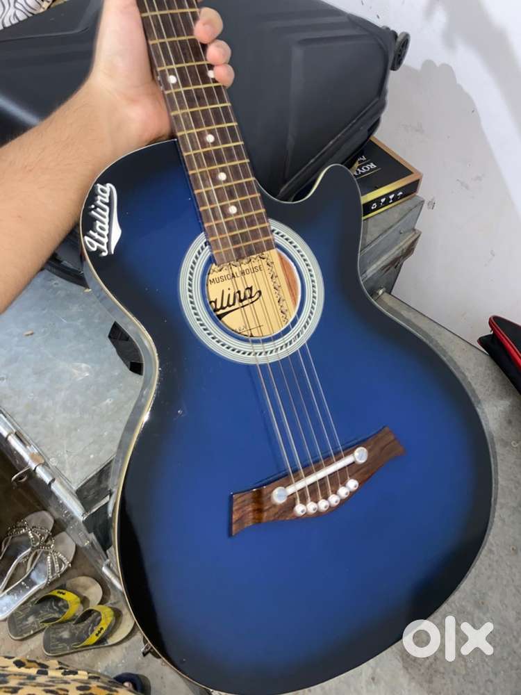 Brand new just 2 months old Blue Italina guitar for beginners.