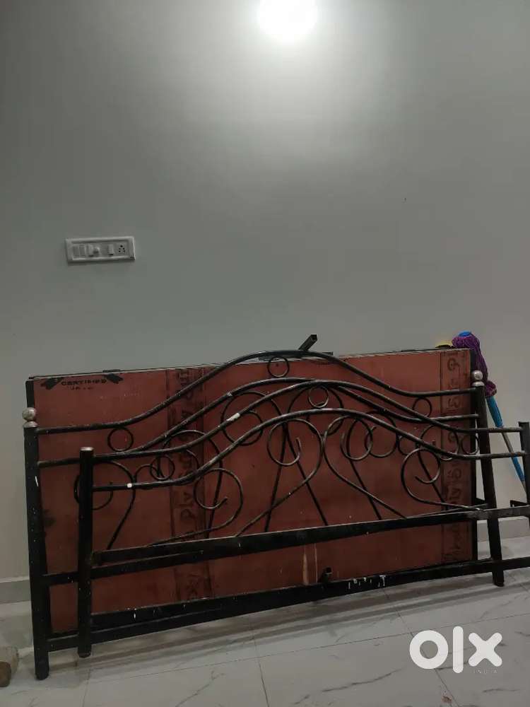 Metal folding bed with attached wooden