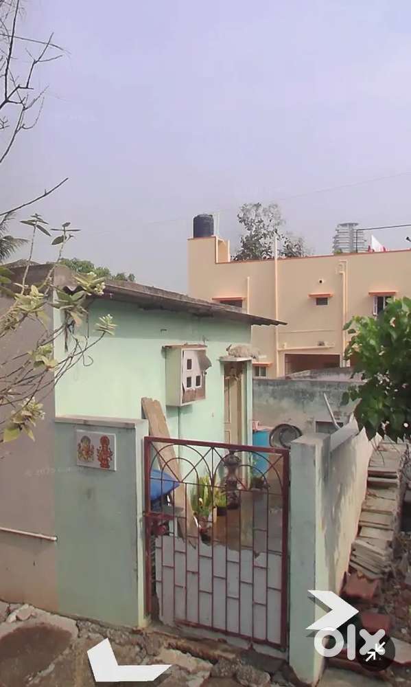 A plot with three sheet houses for sale in AGS layout.